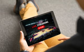 Person streaming media on tablet