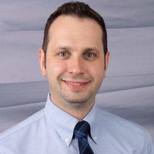 Man in blue business headshot